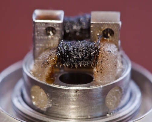 Sucralose residue has caused this vape coil to produce a burnt flavour.